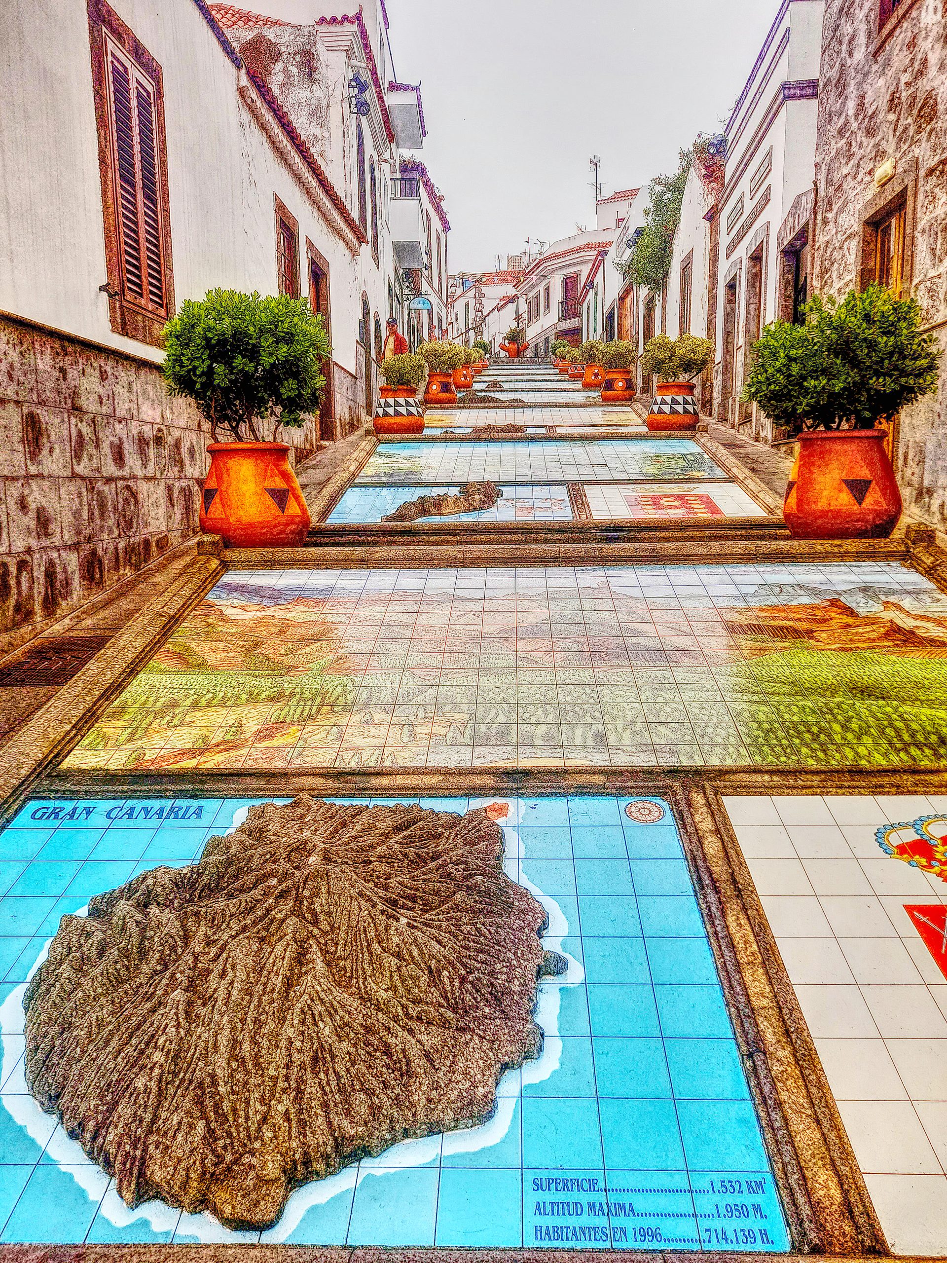 Mosaics and maps of the Canary Islands in Firgas, Gran Canaria, displayed along a charming pedestrian street
